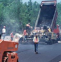 laying out the first course of blacktop